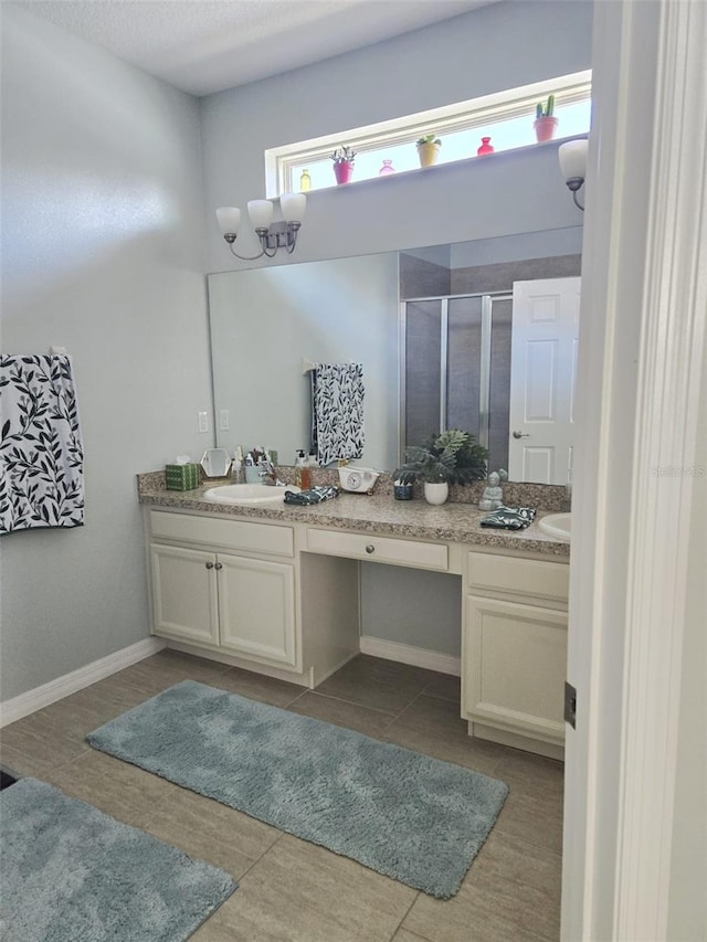 1231 Merion Dr, Mount Dora, FL 32757 - bathroom featuring double vanity, a stall shower, and tile patterned floors