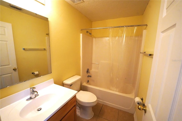 3329 White Blossom Ln, Clermont, FL 34711 - full bath with vanity, tile patterned floors, toilet, shower / tub combo with curtain, and a textured ceiling