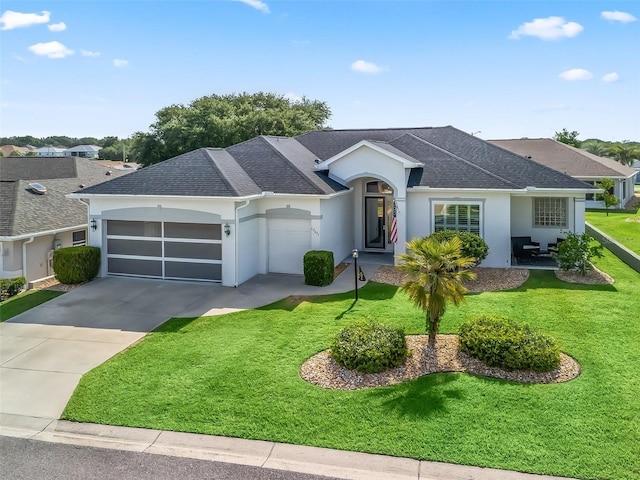 17471 SE 110th Ter, Summerfield, FL 34491 - single story home featuring stucco siding, a garage, a front lawn, concrete driveway, and roof with shingles