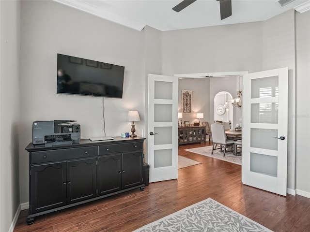 17471 SE 110th Ter, Summerfield, FL 34491 - living area with dark wood-style floors, a chandelier, and ceiling fan