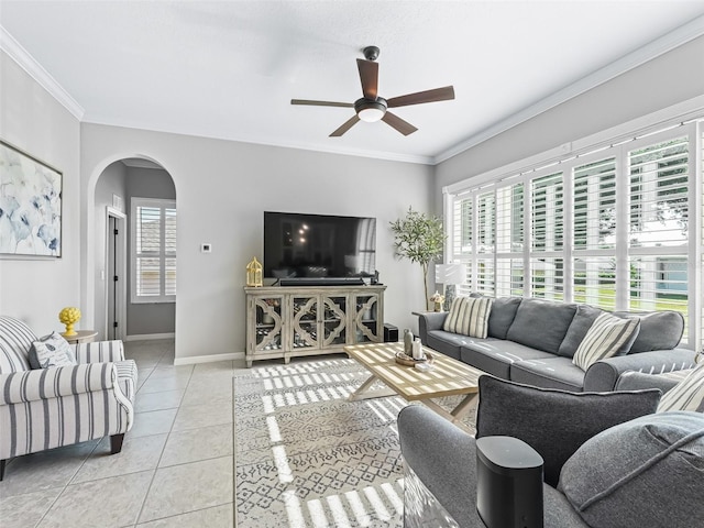 17471 SE 110th Ter, Summerfield, FL 34491 - living room with healthy amount of natural light, ceiling fan, arched walkways, light tile patterned floors, and crown molding