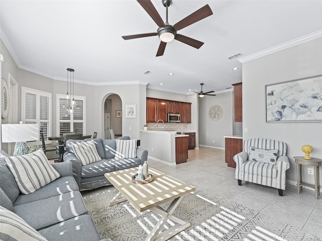 17471 SE 110th Ter, Summerfield, FL 34491 - living area featuring ceiling fan, arched walkways, ornamental molding, light tile patterned floors, and recessed lighting