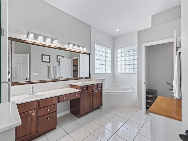 17471 SE 110th Ter, Summerfield, FL 34491 - bathroom featuring double vanity, a bath, and tile patterned floors