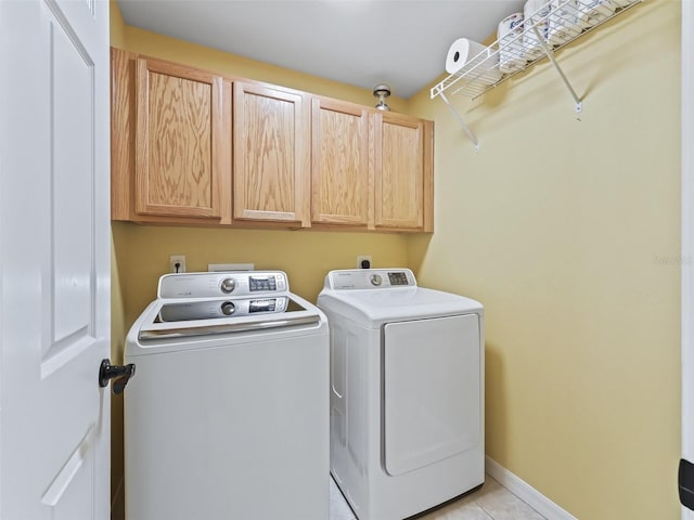 17471 SE 110th Ter, Summerfield, FL 34491 - laundry area featuring cabinet space, washing machine and clothes dryer, light tile patterned flooring, and baseboards