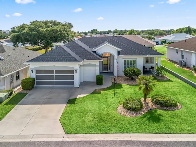 17471 SE 110th Ter, Summerfield, FL 34491 - single story home featuring a shingled roof, an attached garage, driveway, stucco siding, and a front yard