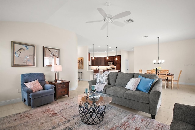 892 Hubbard Loop, The Villages, FL 32163 - living area with light tile patterned floors, ceiling fan, baseboards, a chandelier, and lofted ceiling