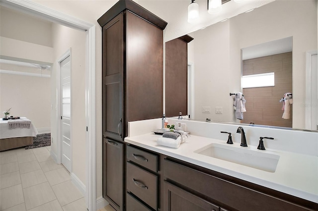 892 Hubbard Loop, The Villages, FL 32163 - bathroom featuring connected bathroom, vanity, and tile patterned floors