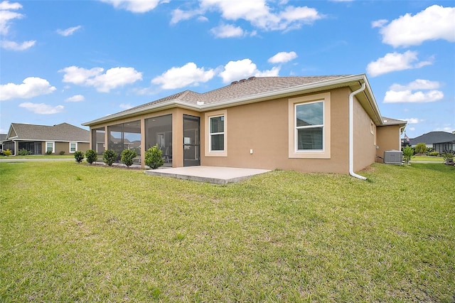892 Hubbard Loop, The Villages, FL 32163 - rear view of property with a patio area, a lawn, a sunroom, and stucco siding