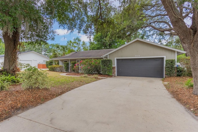 8410 Lake Bosse Dr, Orlando, FL 32810 - single story home featuring driveway and a garage