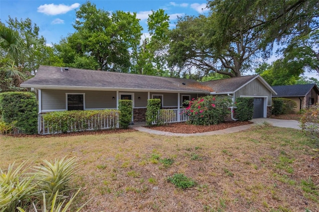 8410 Lake Bosse Dr, Orlando, FL 32810 - ranch-style house featuring covered porch, a garage, a front yard, and driveway