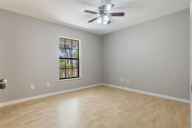 8410 Lake Bosse Dr, Orlando, FL 32810 - unfurnished room featuring light wood finished floors, a ceiling fan, a textured ceiling, and baseboards