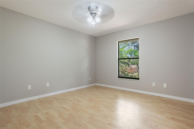8410 Lake Bosse Dr, Orlando, FL 32810 - spare room with a ceiling fan, light wood-type flooring, baseboards, and a textured ceiling