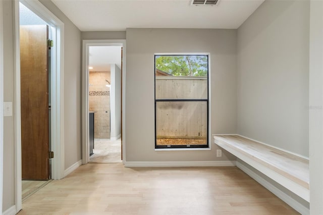 8410 Lake Bosse Dr, Orlando, FL 32810 - hall with light wood-style floors and baseboards