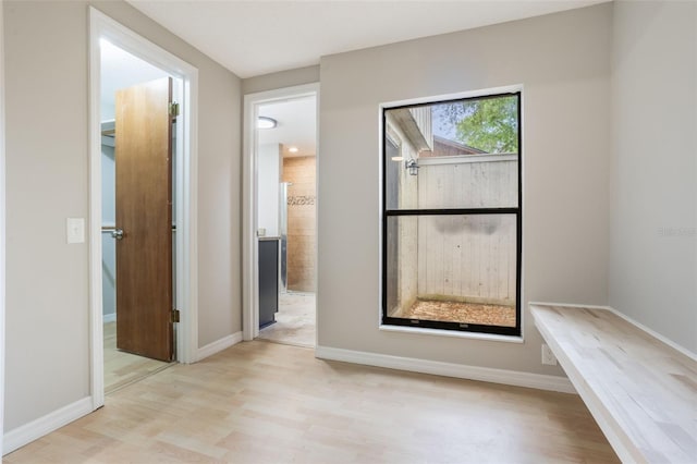 8410 Lake Bosse Dr, Orlando, FL 32810 - corridor featuring light wood-style floors and baseboards