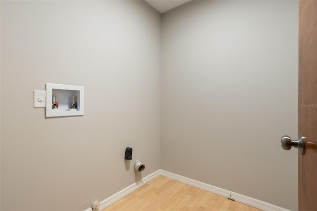 8410 Lake Bosse Dr, Orlando, FL 32810 - laundry room featuring light wood-style floors, washer hookup, and baseboards