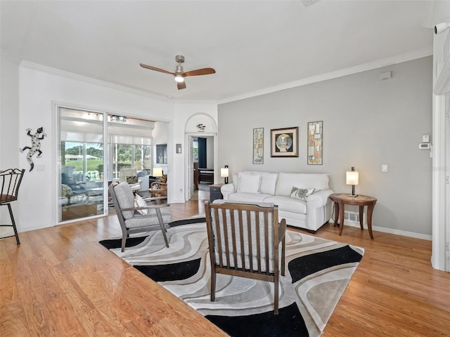 11820 SE 178th St, Summerfield, FL 34491 - living area with a ceiling fan, crown molding, wood finished floors, and baseboards
