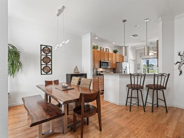 11820 SE 178th St, Summerfield, FL 34491 - dining space featuring light wood-type flooring and baseboards