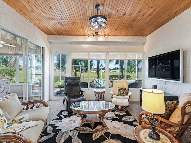11820 SE 178th St, Summerfield, FL 34491 - sunroom / solarium featuring carpet, wood ceiling, healthy amount of natural light, and a textured wall