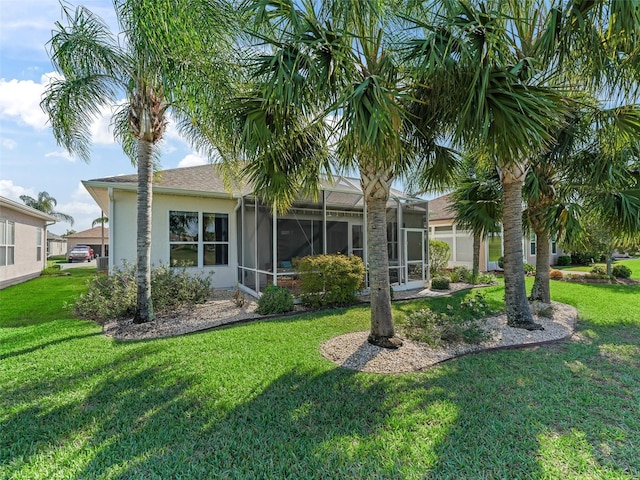 11820 SE 178th St, Summerfield, FL 34491 - back of property featuring a yard and stucco siding