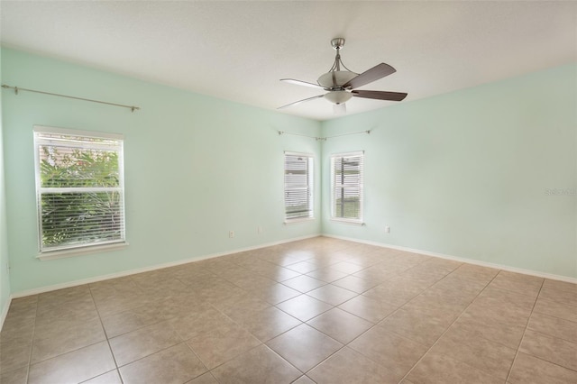 356 Giovani Blvd, Clermont, FL 34715 - spare room with healthy amount of natural light, tile patterned floors, and ceiling fan