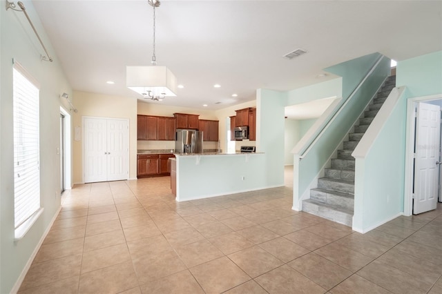 356 Giovani Blvd, Clermont, FL 34715 - kitchen with stainless steel appliances, light tile patterned floors, healthy amount of natural light, and recessed lighting