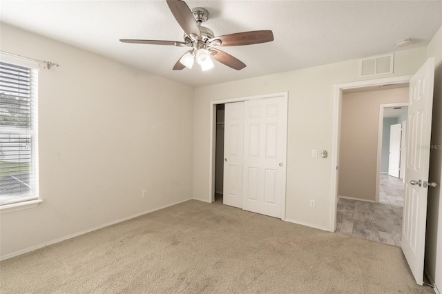 356 Giovani Blvd, Clermont, FL 34715 - unfurnished bedroom featuring carpet flooring, a closet, and ceiling fan