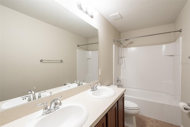 356 Giovani Blvd, Clermont, FL 34715 - full bath featuring double vanity, shower / tub combination, tile patterned flooring, and a textured ceiling