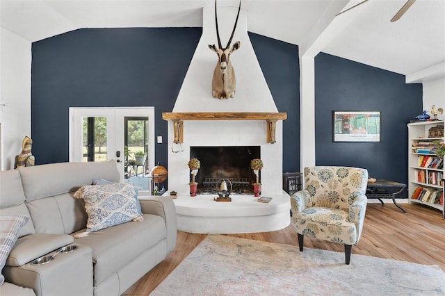 43411 State Road 19, Altoona, FL 32702 - living area with wood finished floors, french doors, high vaulted ceiling, and a fireplace