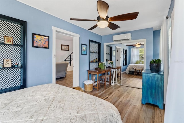 43411 State Road 19, Altoona, FL 32702 - bedroom featuring a wall unit AC, wood finished floors, and a ceiling fan