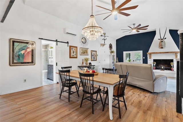 43411 State Road 19, Altoona, FL 32702 - dining room featuring a barn door, a ceiling fan, light wood-style flooring, lofted ceiling, and an AC wall unit
