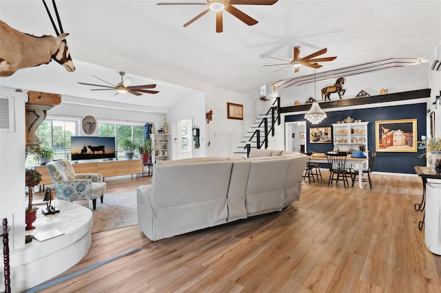 43411 State Road 19, Altoona, FL 32702 - living area featuring a ceiling fan, light wood-style flooring, stairway, and vaulted ceiling