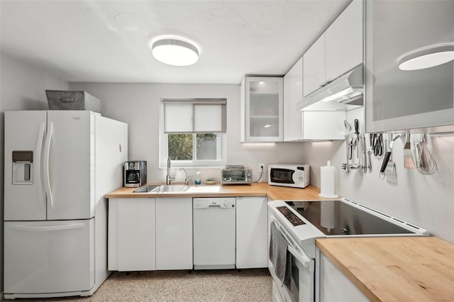 4125 Worcester Rd, Sarasota, FL 34231 - kitchen featuring white appliances, wood counters, under cabinet range hood, and a sink