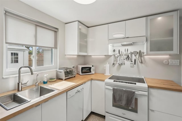4125 Worcester Rd, Sarasota, FL 34231 - kitchen featuring white appliances, under cabinet range hood, a sink, butcher block counters, and white cabinets