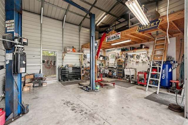 4125 Worcester Rd, Sarasota, FL 34231 - garage featuring a workshop area and metal wall