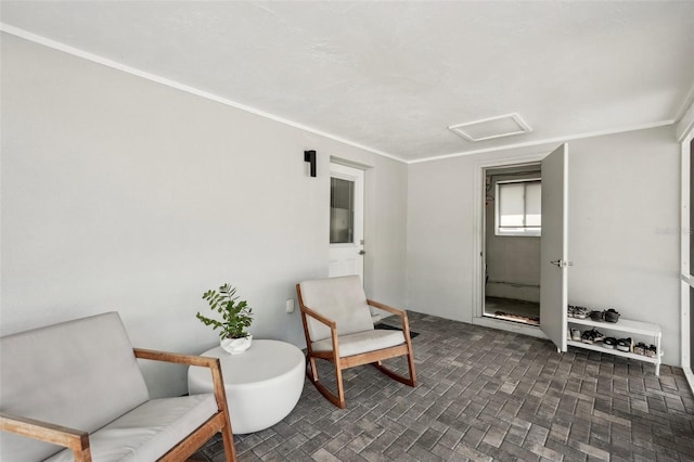 4125 Worcester Rd, Sarasota, FL 34231 - sitting room featuring attic access and ornamental molding