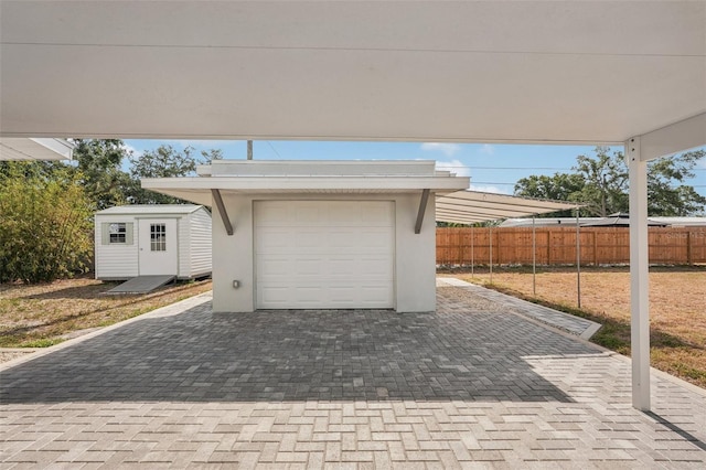 4125 Worcester Rd, Sarasota, FL 34231 - garage with fence and decorative driveway