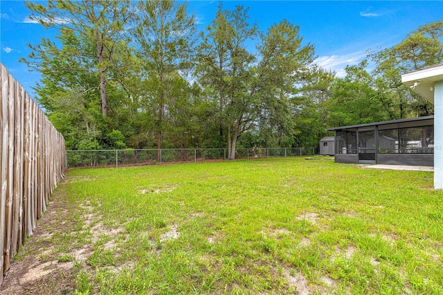 view of yard with a sunroom