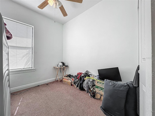 interior space with carpet, lofted ceiling, and ceiling fan