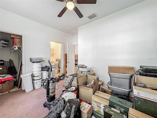 storage room featuring visible vents and a ceiling fan