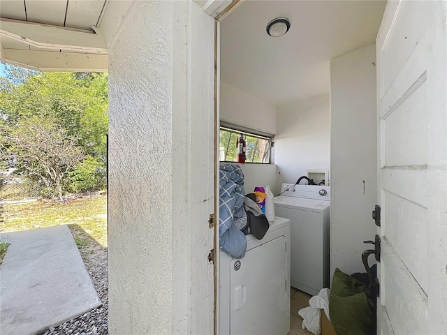 laundry area with washer and clothes dryer and laundry area