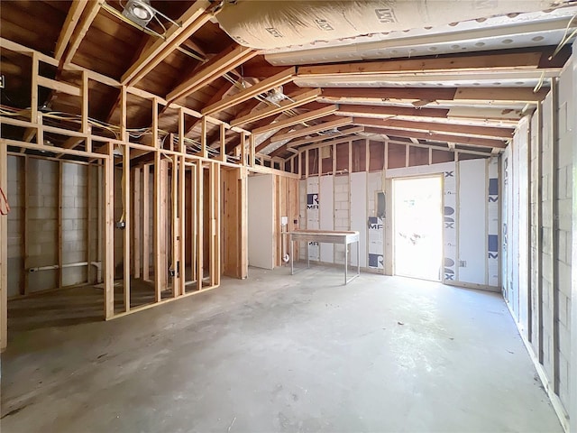 miscellaneous room featuring lofted ceiling