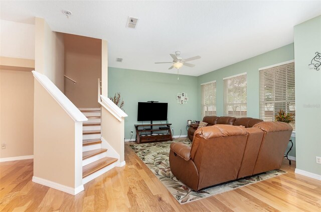 866 Ashworth Overlook Dr Unit B, Apopka, FL 32712 - living room featuring wood finished floors, ceiling fan, stairway, and baseboards