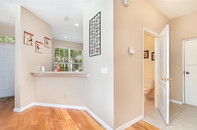 866 Ashworth Overlook Dr Unit B, Apopka, FL 32712 - hallway featuring baseboards, recessed lighting, and wood finished floors
