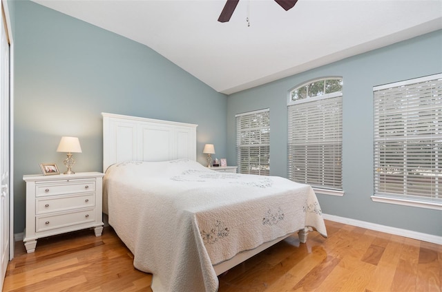 866 Ashworth Overlook Dr Unit B, Apopka, FL 32712 - bedroom with vaulted ceiling, wood finished floors, baseboards, and ceiling fan