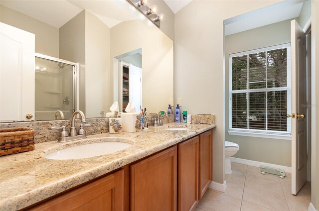 866 Ashworth Overlook Dr Unit B, Apopka, FL 32712 - bathroom with a stall shower, tile patterned floors, toilet, double vanity, and baseboards
