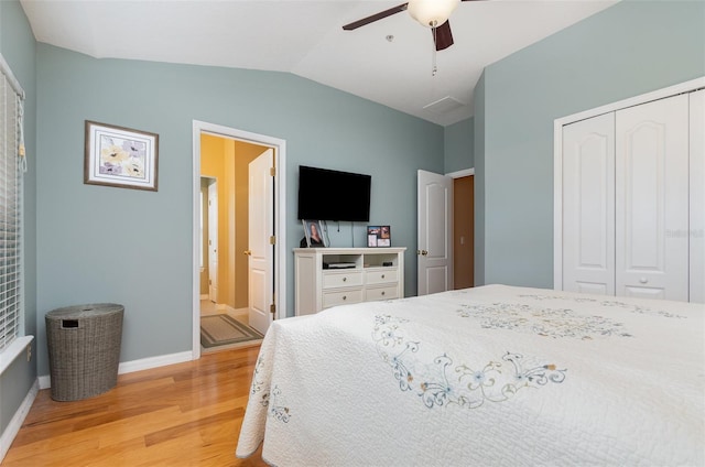 866 Ashworth Overlook Dr Unit B, Apopka, FL 32712 - bedroom featuring light wood-style floors, lofted ceiling, a closet, baseboards, and a ceiling fan