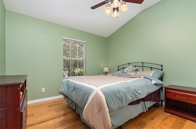 866 Ashworth Overlook Dr Unit B, Apopka, FL 32712 - bedroom with light wood-type flooring, lofted ceiling, baseboards, and a ceiling fan