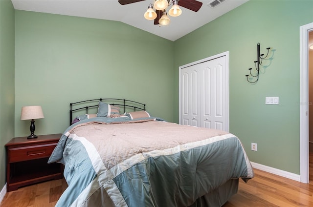 866 Ashworth Overlook Dr Unit B, Apopka, FL 32712 - bedroom with baseboards, a closet, vaulted ceiling, and light wood-type flooring