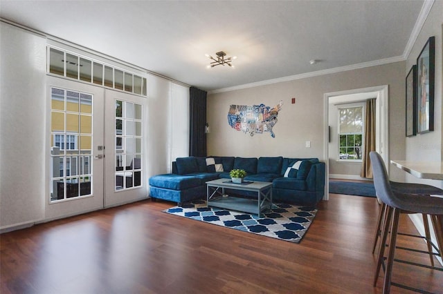 living area featuring ornamental molding, french doors, and wood finished floors