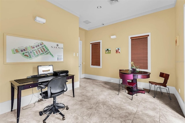 tiled office featuring visible vents and baseboards